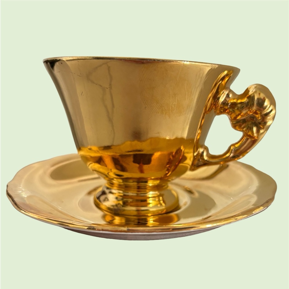 Precious and rare ROYAL WINTON Golden Age Grimwades gold teacup and saucer.